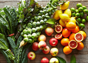 a group of fruits and vegetables on a wood surface Healthy Weight Loss Diets Bournemouth